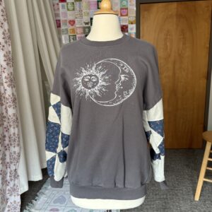 Upcycled Sun & Moon Sweatshirt with Patchwork Quilted Sleeves – Grey, Cream, & Blue